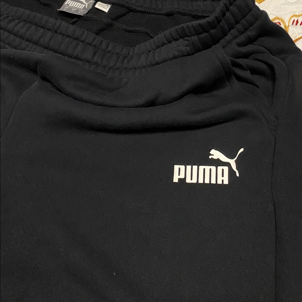 Mens black Puma joggers.